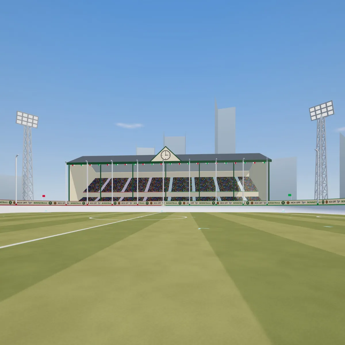 The main stand seen from the pitch: two tiers under a gabled roof, a clock at three o'clock in the pediment, and a floodlight pylon either side